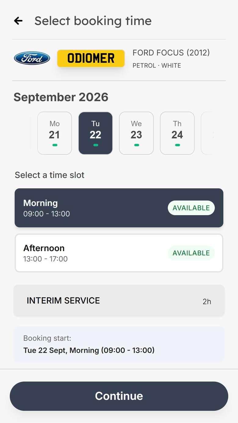 A customer on a phone choosing a date and a morning or afternoon slot for an interim service on a Ford Focus, on a Garage Shift booking page